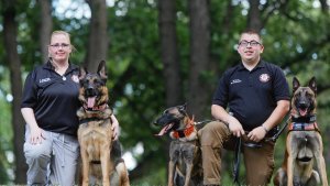Ammie Zachow with Tazer and Nate Dutt with Ziva and Sully are part of the nonprofit MinnKota Search and Rescue that participate in tracking, rescue and recovery missions. David Samson / The Forum